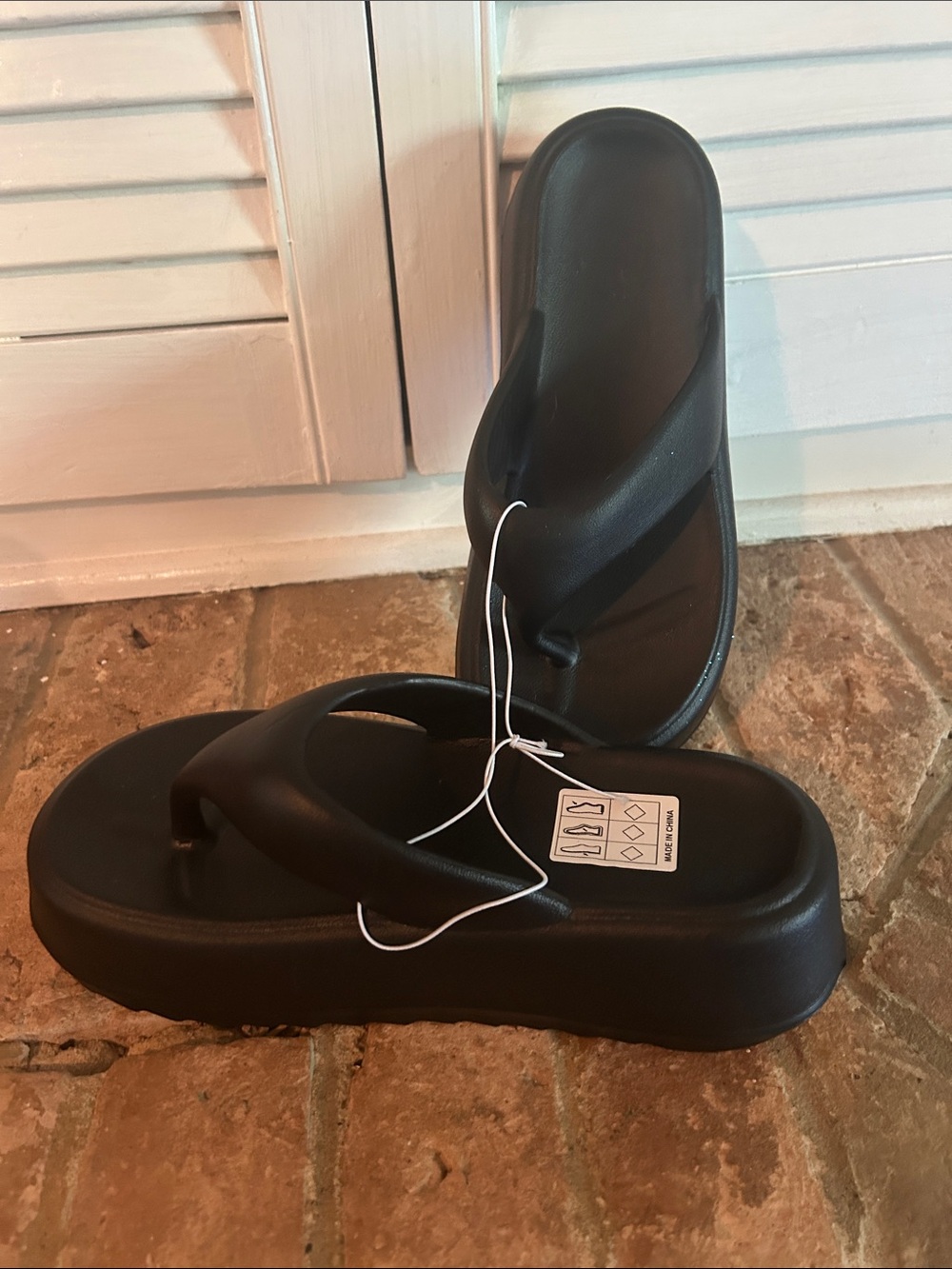 NWT black, thick sole beach slippers.